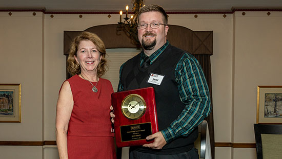 Jared Shank receives MHEC Outstanding Service Award.