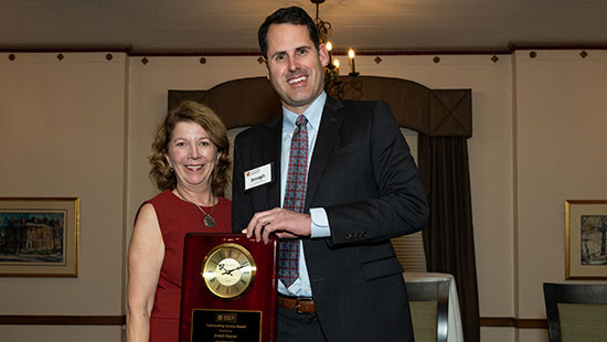 Joseph Rayzor receives MHEC Outstanding Service Award.