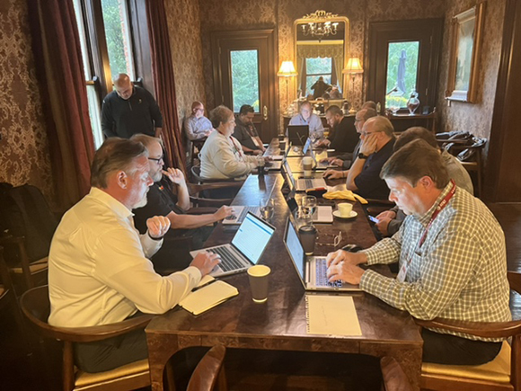 Nathan Sorensen, MHEC director of government contracts, pictured front left, hosts institutional members for their feedback on enterprise resource planning.