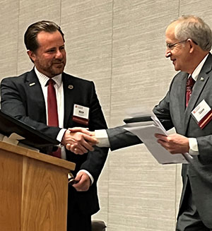 Rep. Rick Carfagna (OH) receives the gavel from Dr. David Eisler.