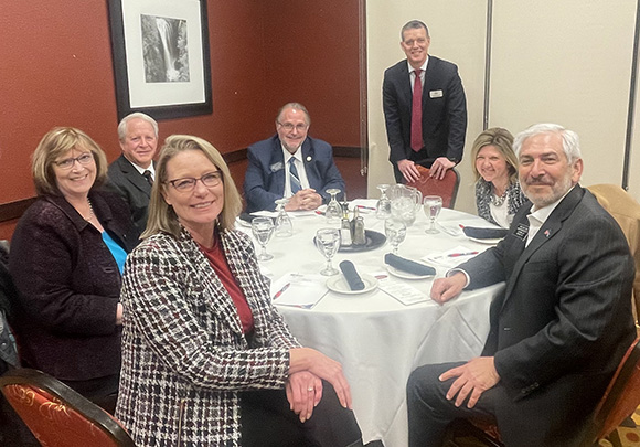 South Dakota higher education and legislative leaders sitting around a table. 
