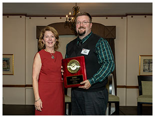 Jared Shank, Ohio Department of Higher Education, receives MHEC's Outstanding Service Award from President Susan Heegaard