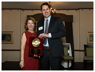 Joseph Rayzor, University of Northern Iowa Director of Risk Management, receives MHEC Outstanding Service Award from President Susan Heegaard.